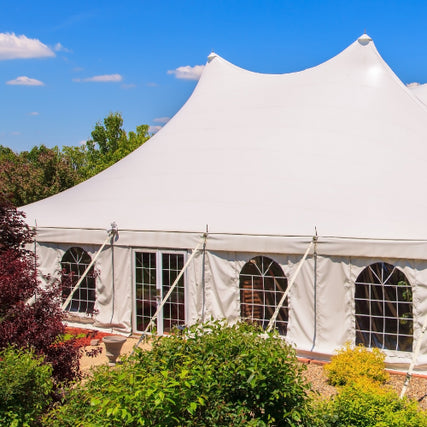 Party & Event RentalsA white tent set up outdoors on a clear day